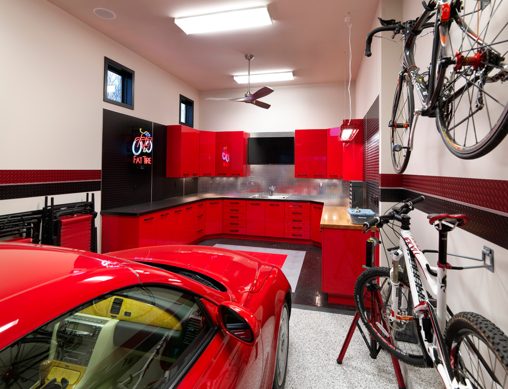 This is an example of a medium sized contemporary attached single garage workshop in Other.