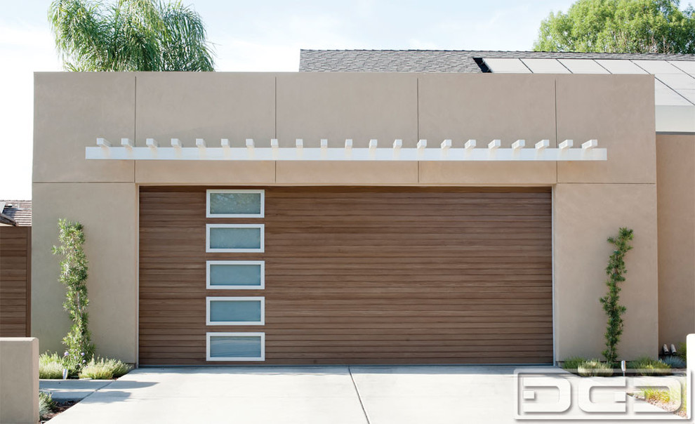 Источник вдохновения для домашнего уюта: большой пристроенный гараж в стиле модернизм для двух машин