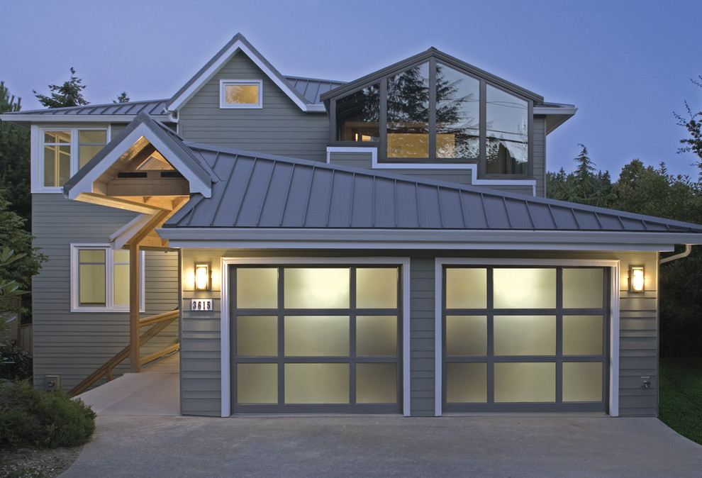 Photo of a medium sized modern attached double garage in Kansas City.