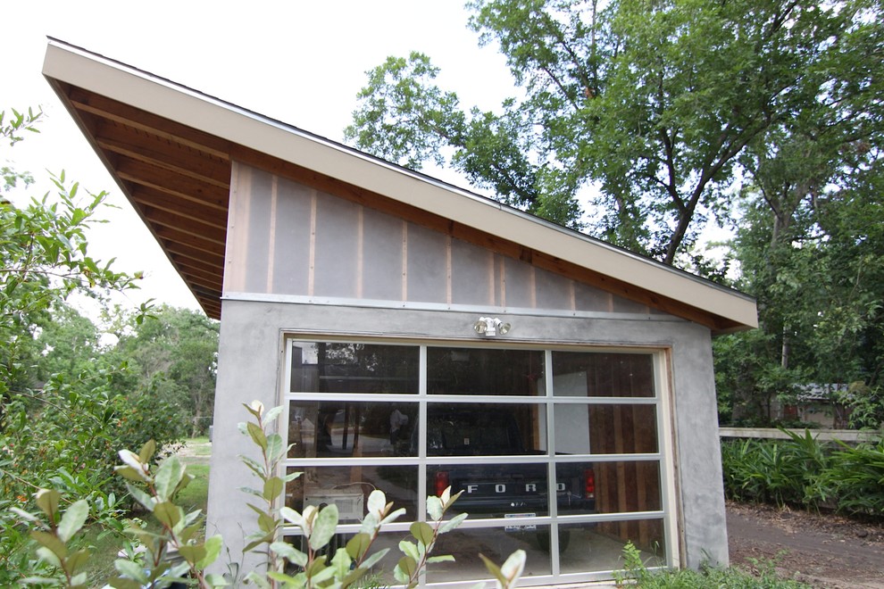 Пример оригинального дизайна: маленький отдельно стоящий гараж в стиле модернизм для на участке и в саду, одной машины
