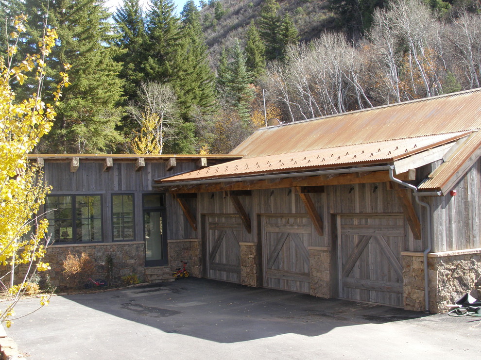 Design ideas for a rustic attached garage in Denver with three or more cars.