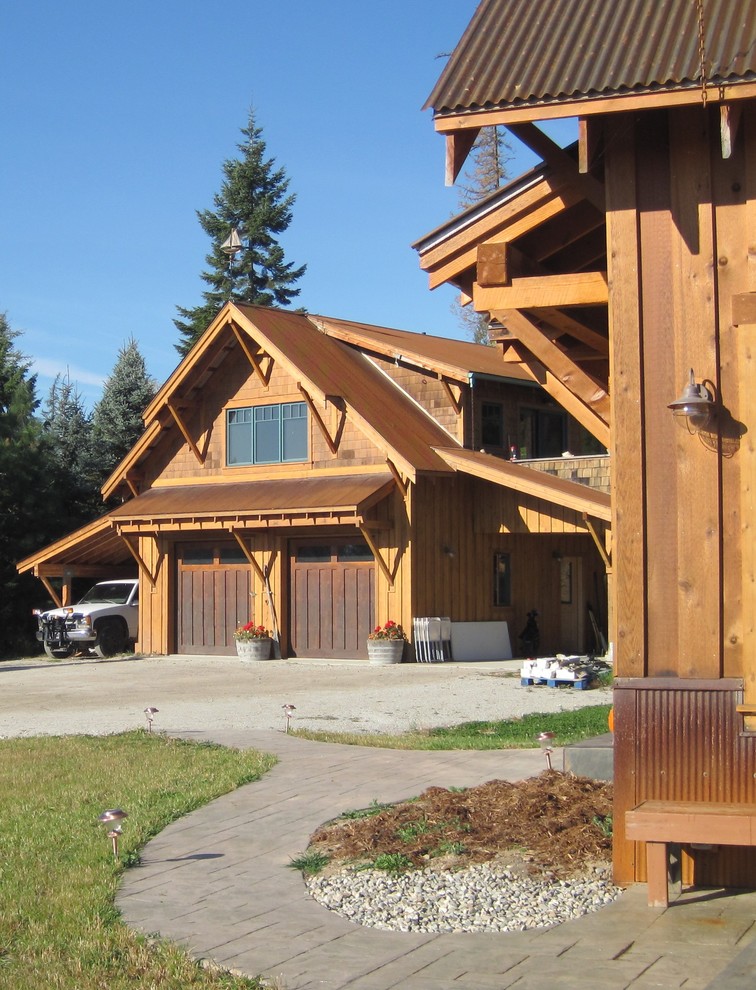 This is an example of a medium sized rustic detached double garage in Seattle.