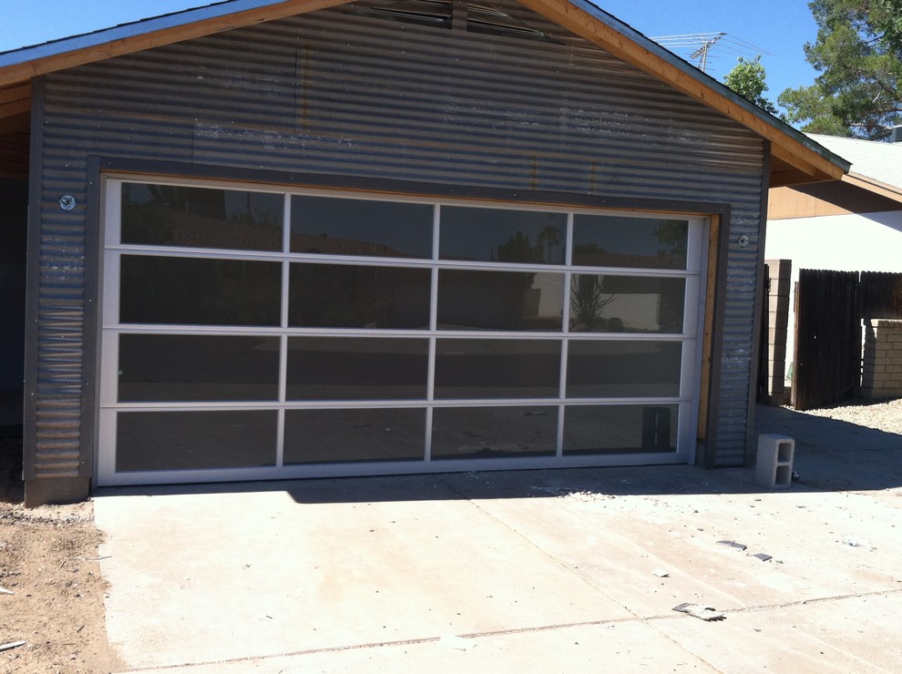 Garage workshop - mid-sized modern attached two-car garage workshop idea in Phoenix