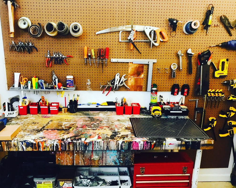 Mid-sized trendy attached one-car garage workshop photo in Boston