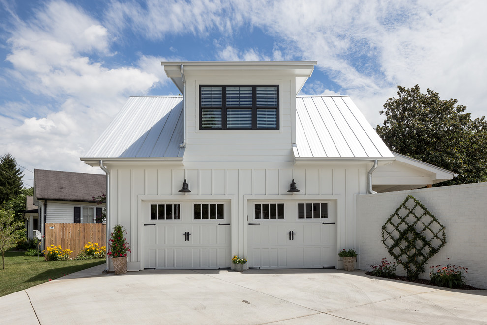 Garage - mid-sized country attached two-car garage idea in Nashville