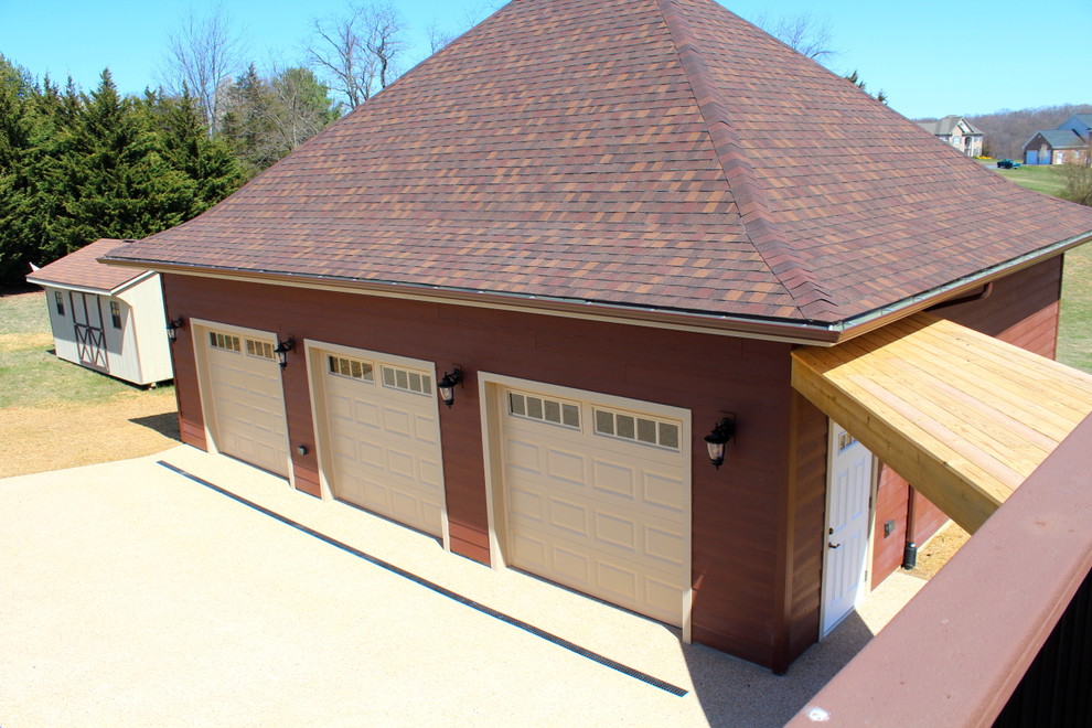 Large traditional detached garage in Other with three or more cars.