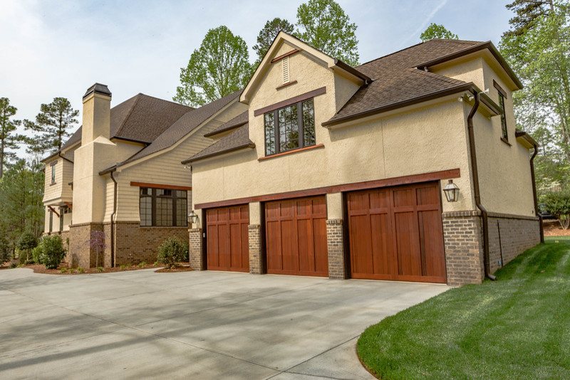 Photo of a traditional attached garage in Charlotte with three or more cars.