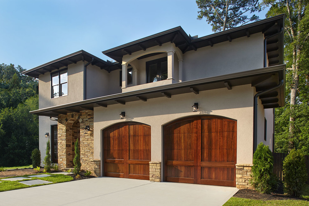 Mid-sized tuscan attached two-car garage photo in Atlanta