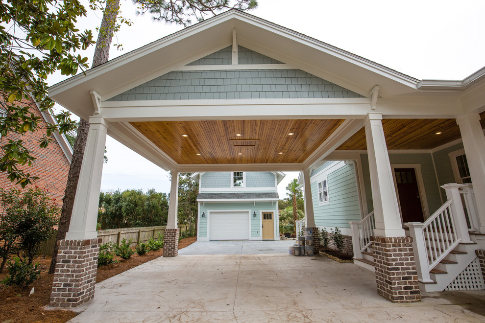 Example of a large arts and crafts detached one-car porte cochere design in Other