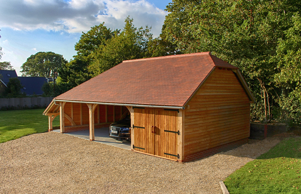 Inspiration for a large traditional detached carport in Hampshire with three or more cars.