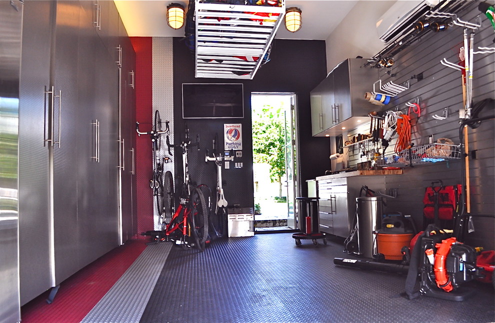 Inspiration for a medium sized modern attached single garage workshop in Charlotte.