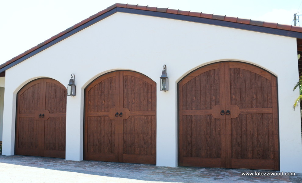 Expansive mediterranean attached garage in Orlando with three or more cars.