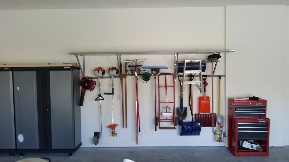 This is an example of a large classic attached garage workshop in Omaha.
