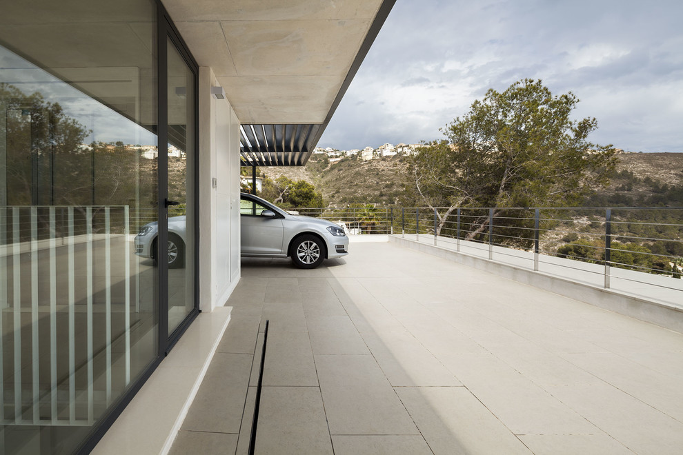 На фото: пристроенный гараж в современном стиле для двух машин