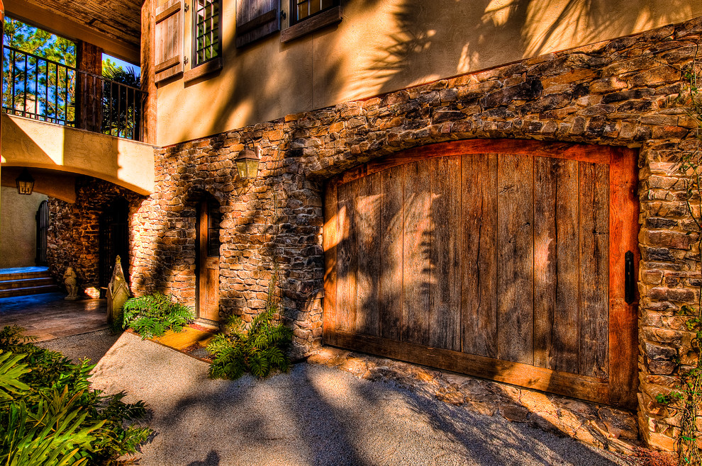 This is an example of a large rustic attached single garage in Charleston.