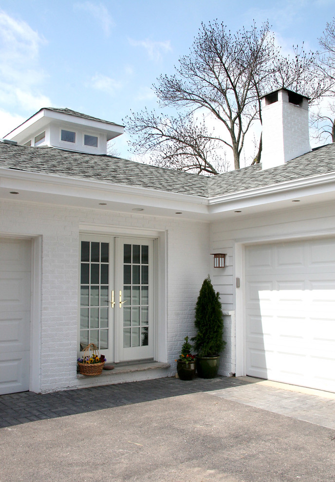 Small elegant attached two-car garage photo in Chicago