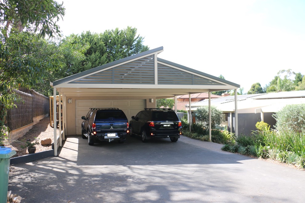 Large minimalist detached two-car carport photo in Melbourne