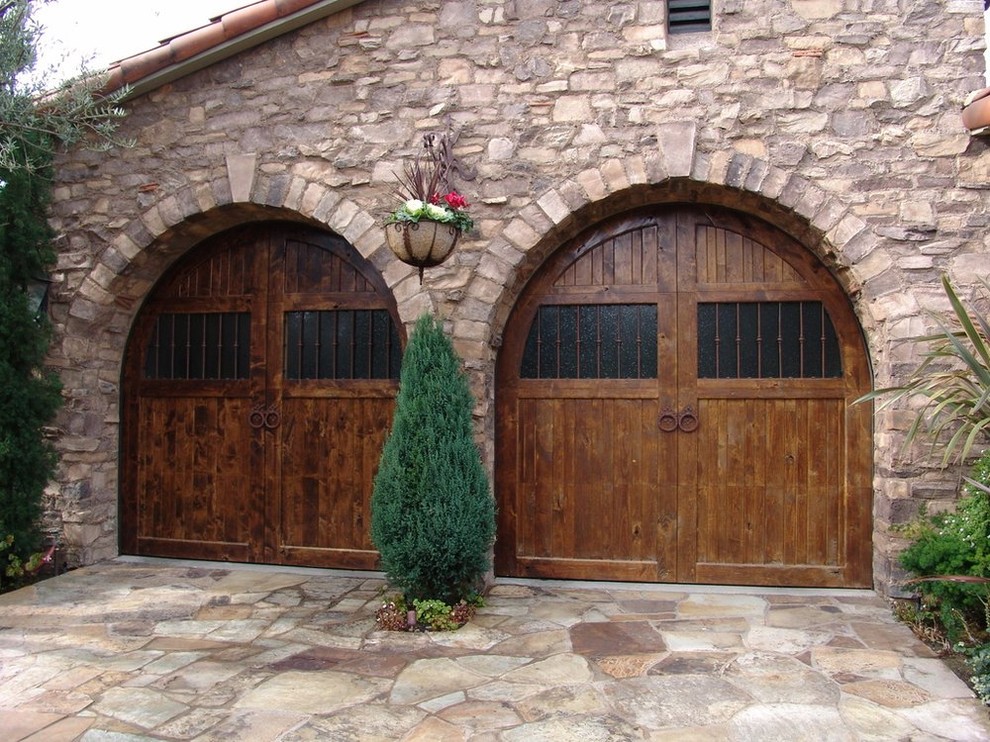 Photo of a medium sized mediterranean attached double garage in Los Angeles.