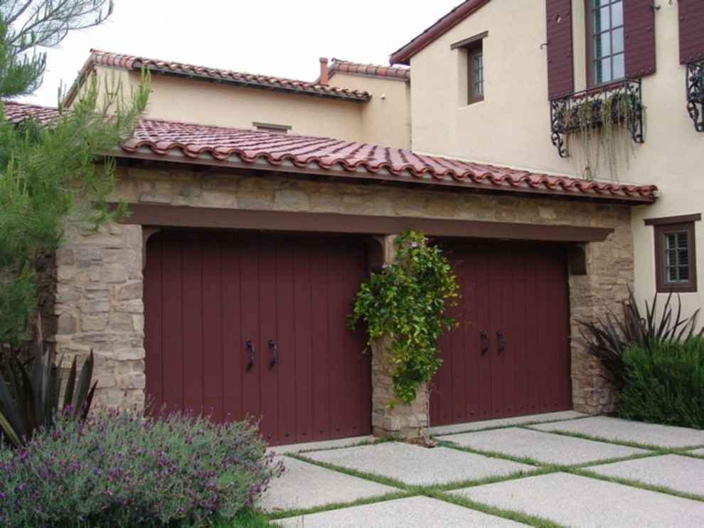 Design ideas for a medium sized mediterranean attached double garage in Los Angeles.