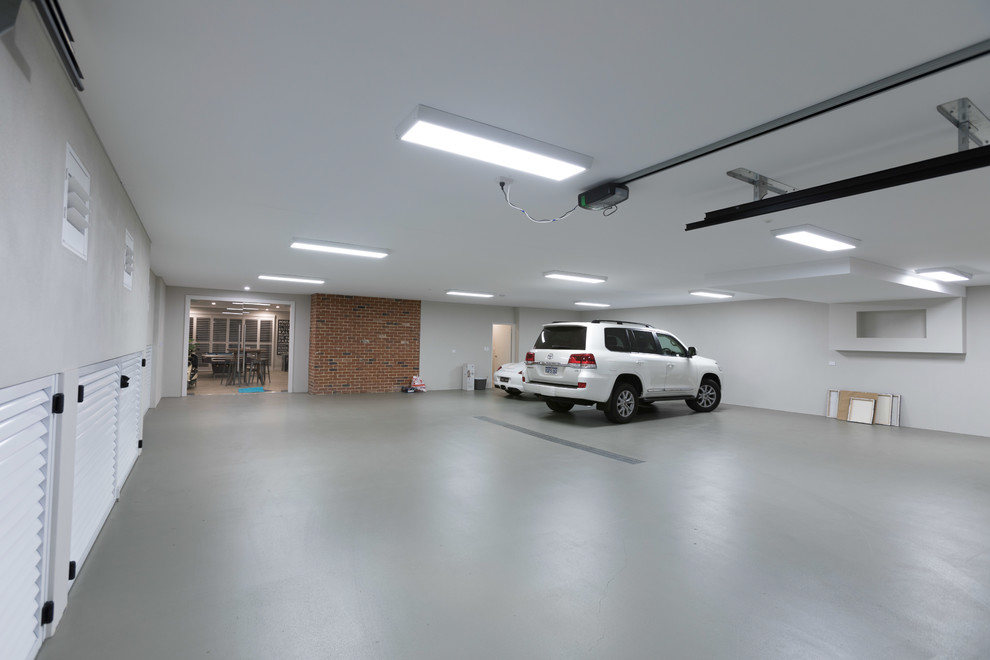 Inspiration for a huge timeless attached four-car garage remodel in Perth