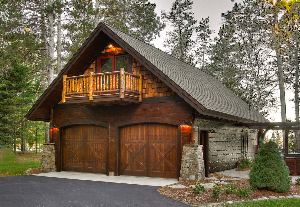 Example of a mountain style detached two-car garage design in Minneapolis