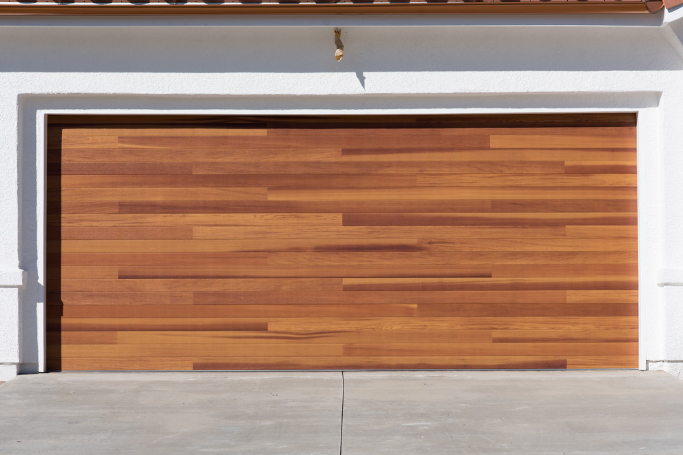 Photo of a contemporary attached double garage in Los Angeles.