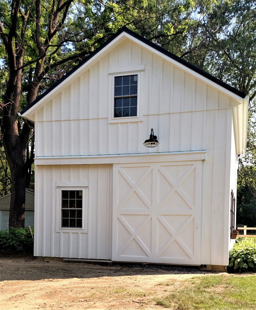 Idée de décoration pour un garage séparé champêtre de taille moyenne avec un bureau, studio ou atelier.