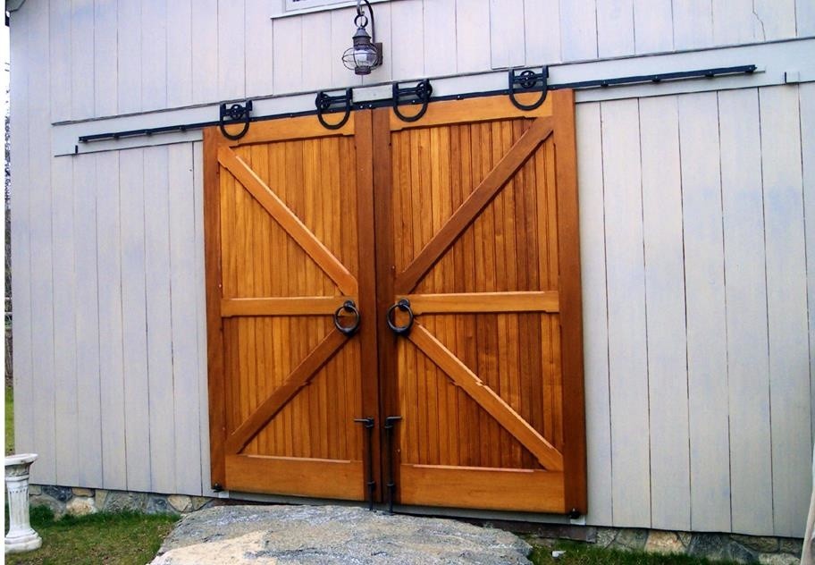 This is an example of a medium sized rustic attached single garage in New York.