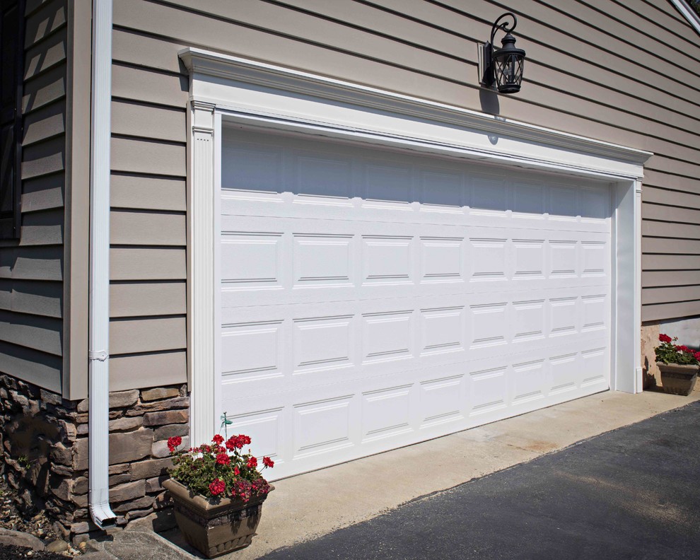 Garage - large traditional attached two-car garage idea in Philadelphia