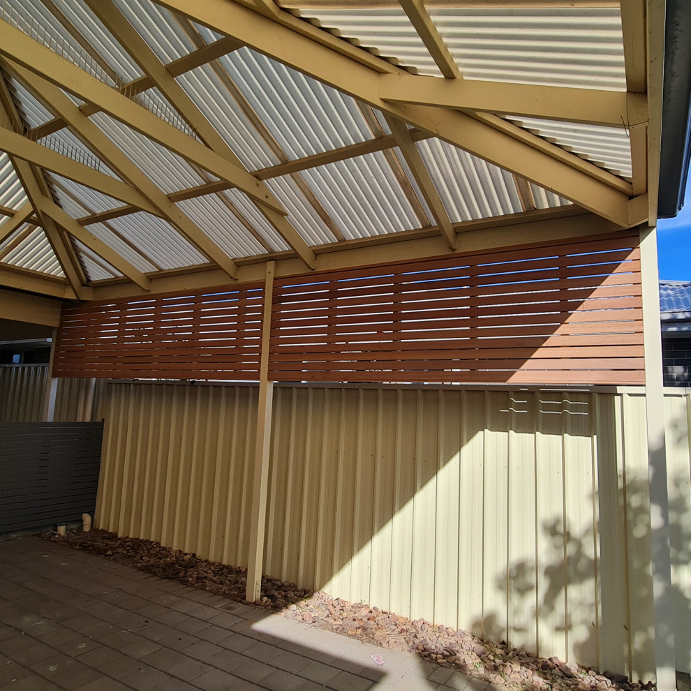 Photo of a large contemporary detached double carport in Adelaide.