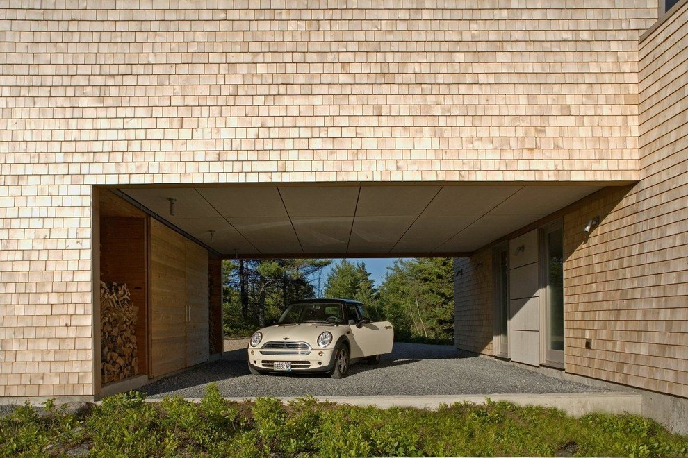 Exemple d'un garage moderne avec une porte cochère.