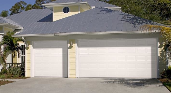 This is an example of a large nautical attached double garage in Boston.