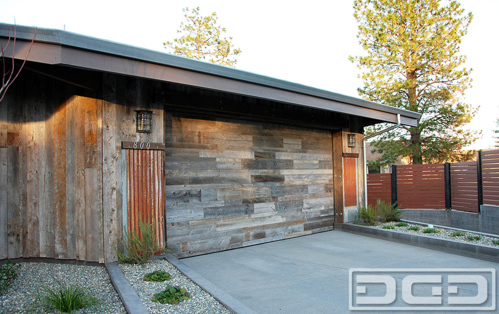 Garage - large industrial attached two-car garage idea in San Francisco