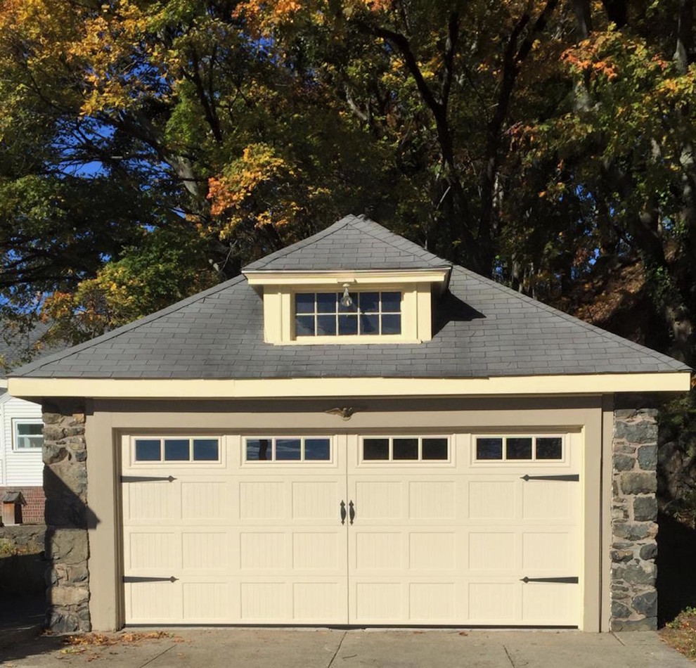 Example of a large classic attached two-car garage design in Boston