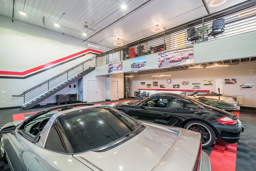 Inspiration for a large industrial four-car garage remodel in Chicago