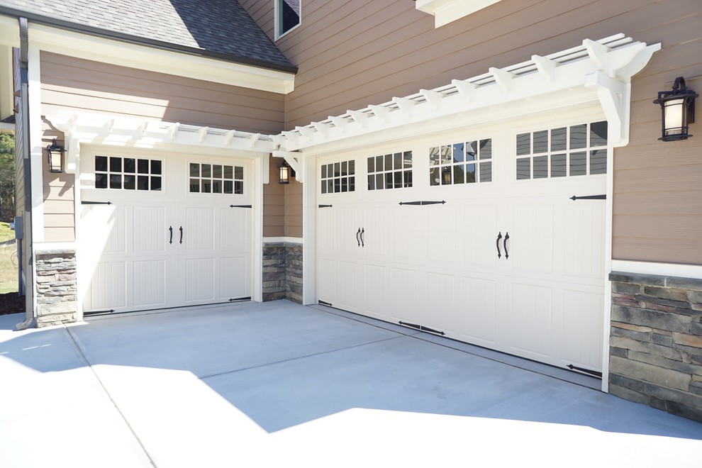 Design ideas for a large contemporary attached carport in Raleigh with three or more cars.