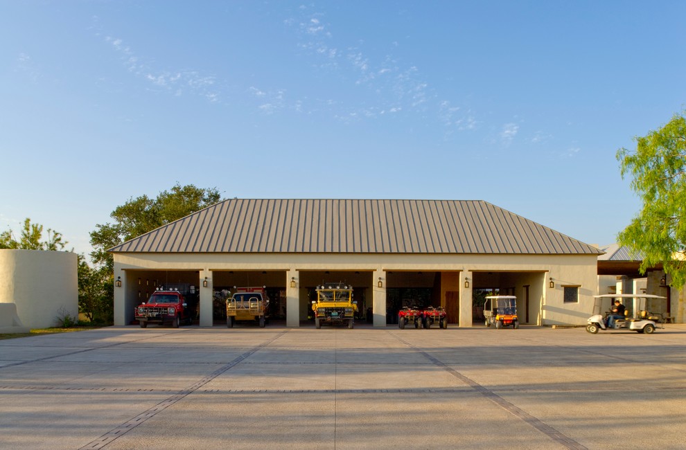Garage - southwestern four-car garage idea in Houston