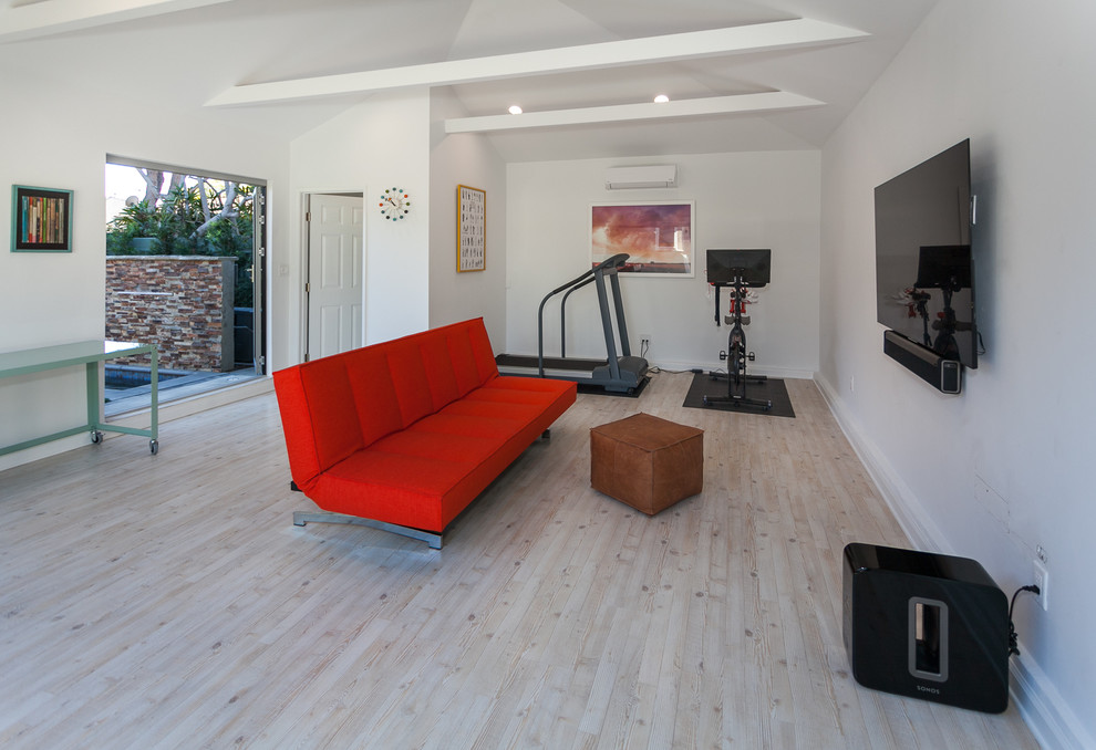 Example of a mid-sized minimalist detached two-car garage workshop design in Los Angeles