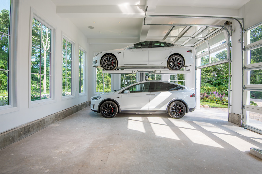 Garage - huge attached three-car garage idea in New York