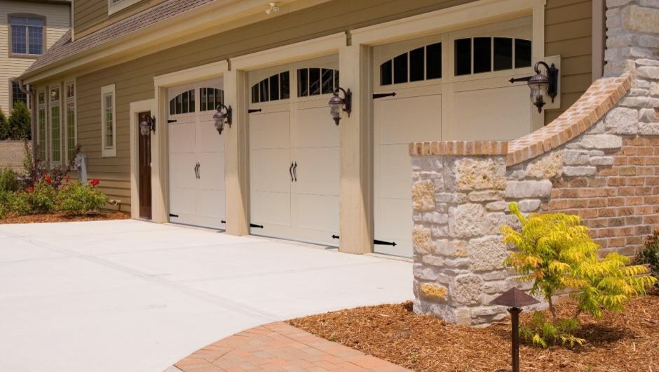 Inspiration for a large traditional attached carport in Orange County with three or more cars.