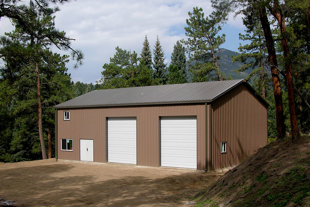 Example of a large urban detached four-car garage workshop design in Other