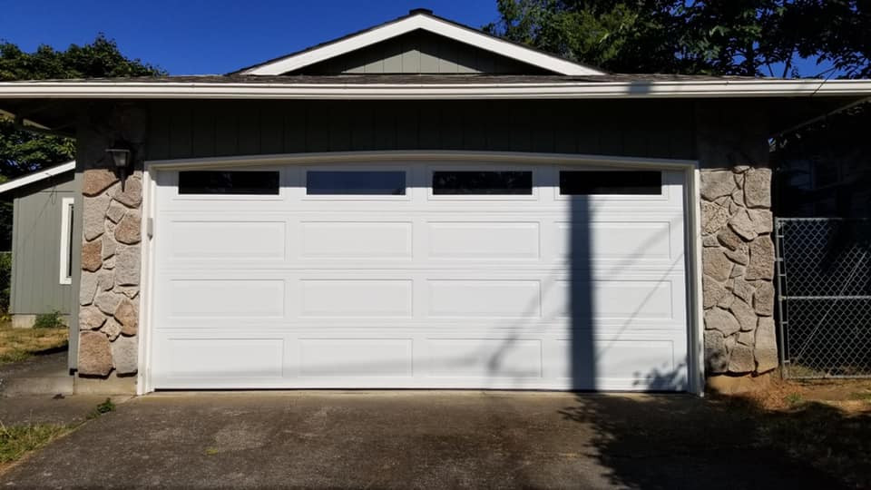 This is an example of a medium sized classic attached double garage in St Louis.
