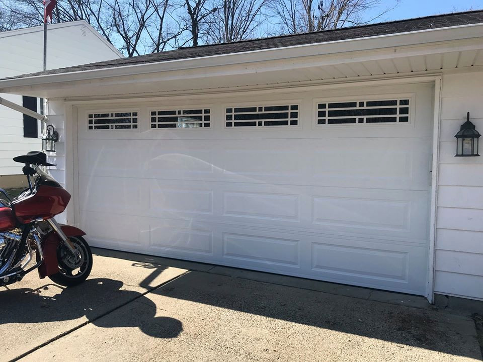 Medium sized traditional attached double garage in St Louis.
