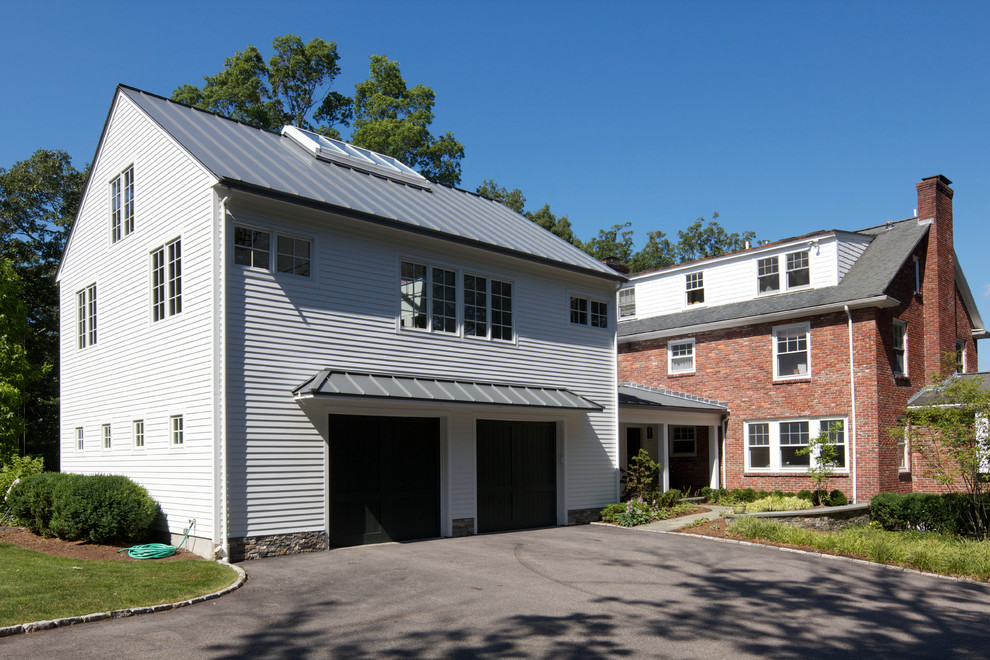 This is an example of a traditional attached double garage workshop in Boston.
