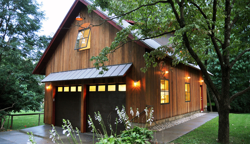 Inspiration for a large rustic detached double garage workshop in Louisville.
