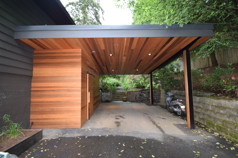 Mid-sized minimalist attached garage photo in Portland