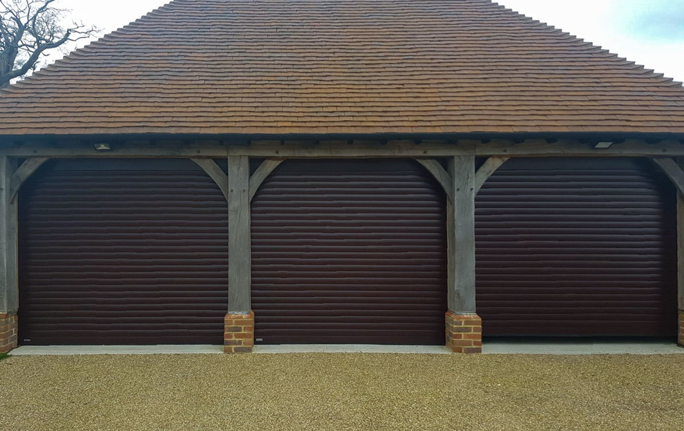 SWS Securoglide Roller Garage Doors in a Rosewood Woodgrain Garage