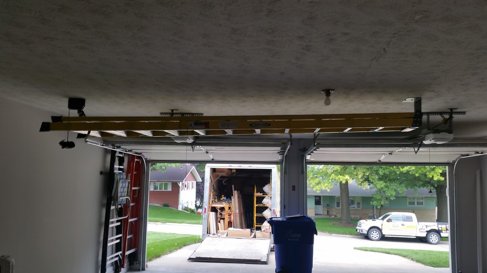 Medium sized traditional attached double garage in Omaha.
