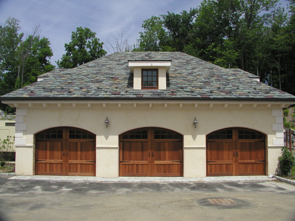 Photo of an expansive mediterranean attached carport in New York with three or more cars.