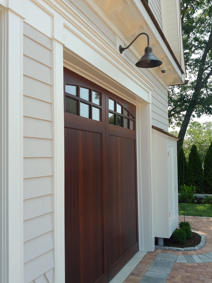 This is an example of a medium sized traditional attached garage in New York.
